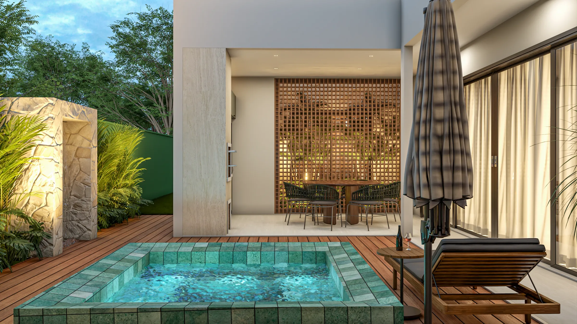 Área de lazer do Residencial JO com spa revestido de pastilha verde em deck de madeira, espreguiçadeira, guarda-sol e espaço gourmet com mesa e cadeiras de corda ao fundo